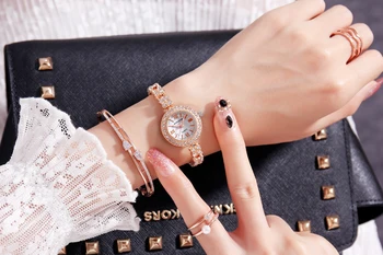 KINGNUOS Žien high-end módny náramok z nerezovej ocele sledovať crystal analóg quartz hodinky dámske športové šaty hodiny